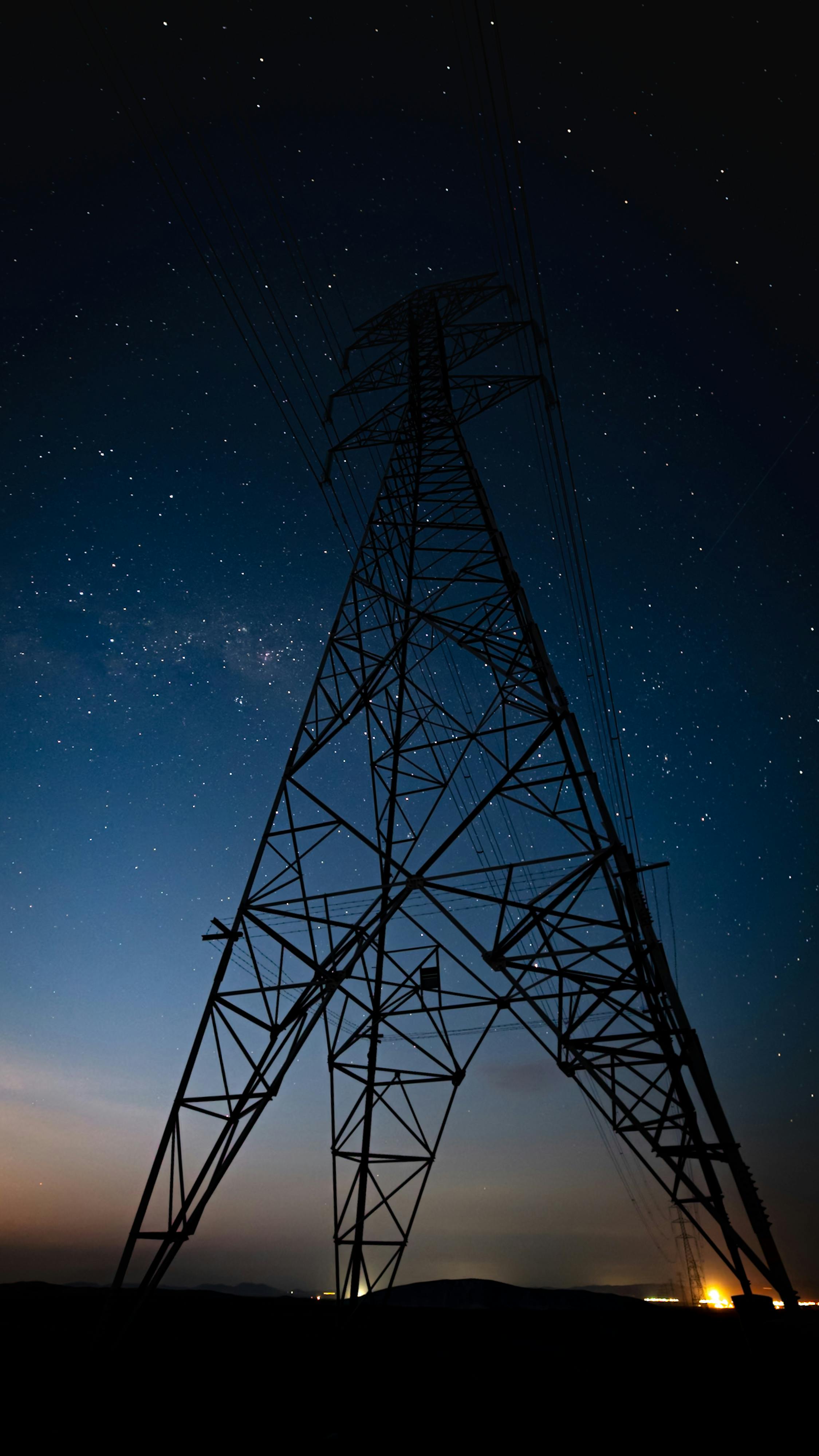 Transmission pylon against night sky